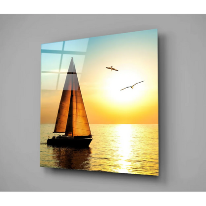 Vibrant sailboat glass wall art with orange sunset sails and seagulls