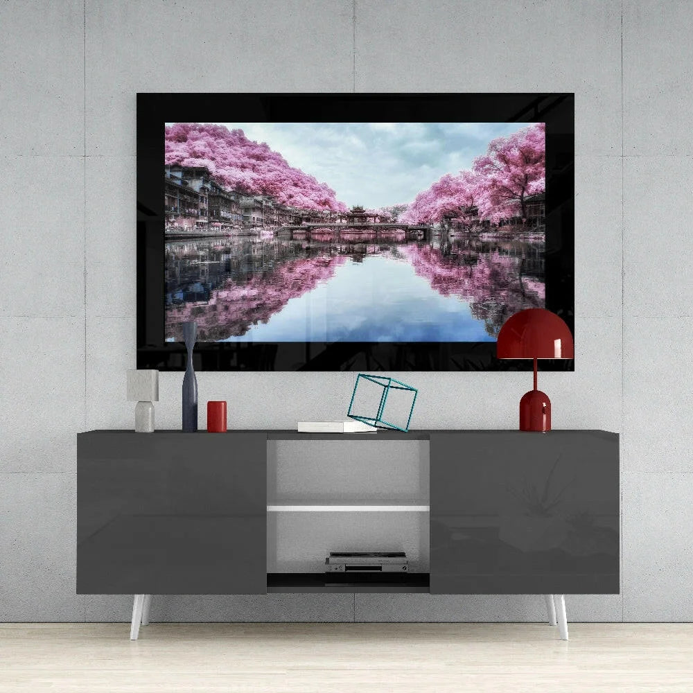 Sleek Samsung QLED glass wall art TV in black frame and gray stand