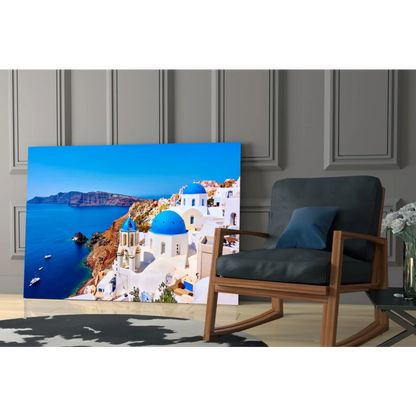 Stunning Santorini glass wall art canvas print of white buildings and blue domes on cliffs