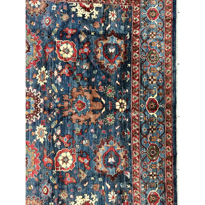 Stunning Serapi transitional rug with intricate floral patterns in deep blue, red, cream and rust