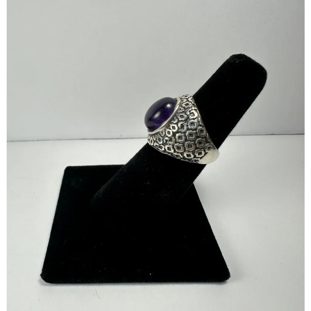 Stunning silver amethyst ring with deep purple oval stone and geometric band