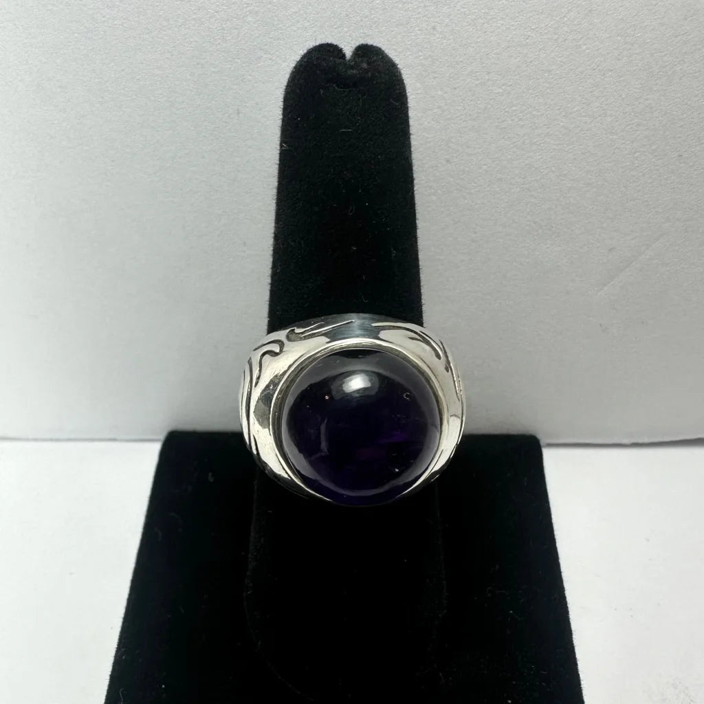 Stunning silver amethyst ring with swirling design and bold purple stone