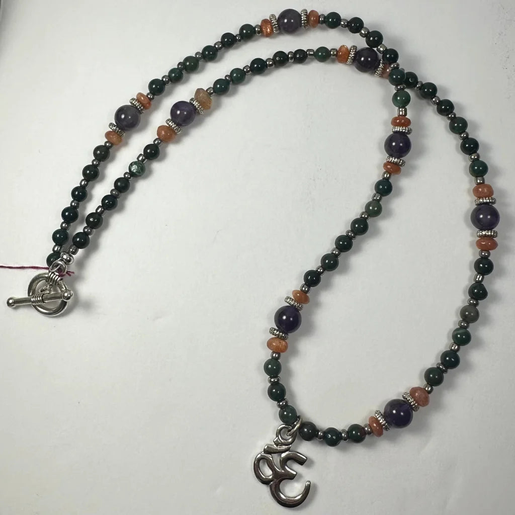 Stunning silver om pendant with amethyst mala beads necklace