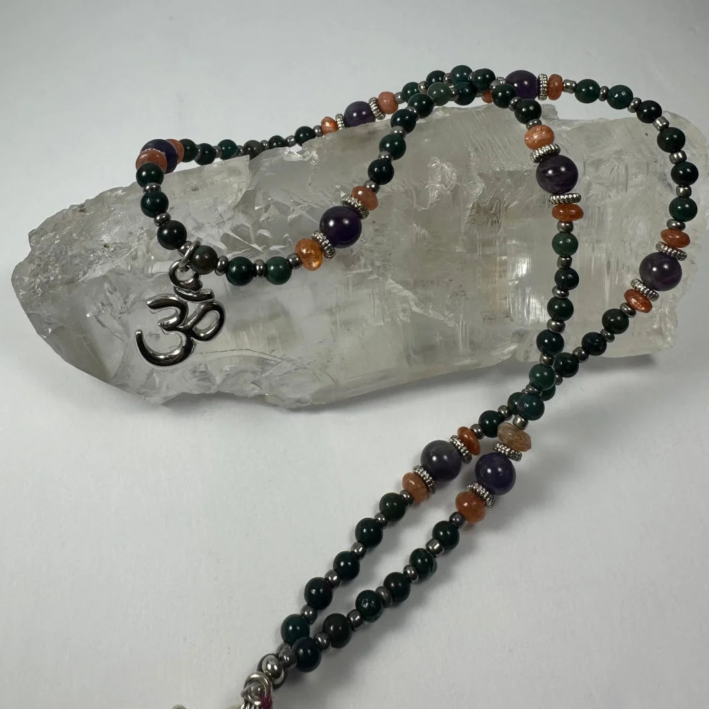Stunning silver om pendant mala with amethyst beads in green, purple, orange
