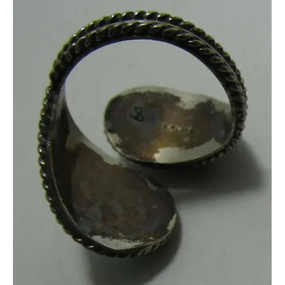 Silver open cuff ring with twisted rope edges featuring Sleeping Beauty Turquoise design