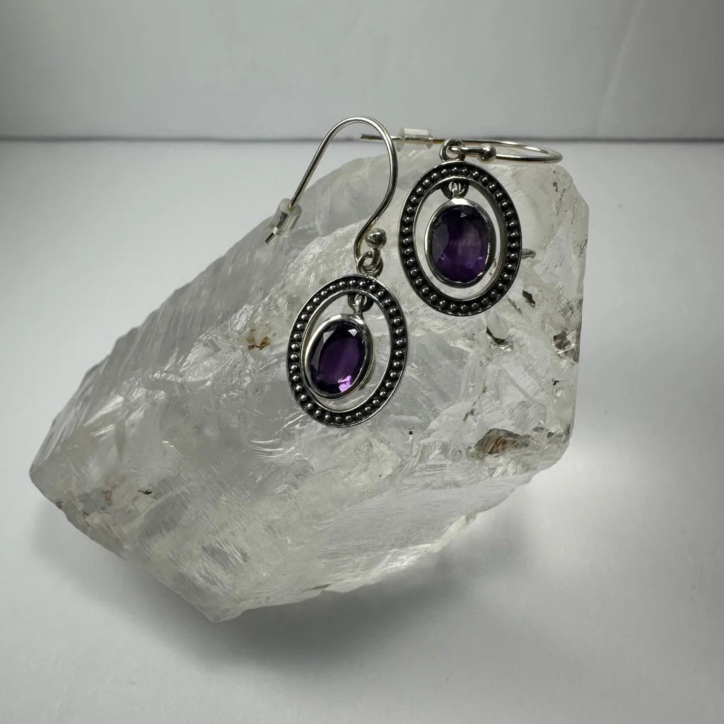 Stunning silver amethyst earrings with oval purple stones and beaded frames