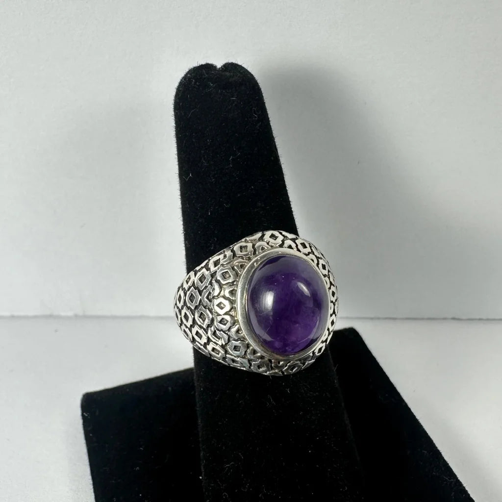 Stunning silver amethyst ring with geometric band and oval purple stone
