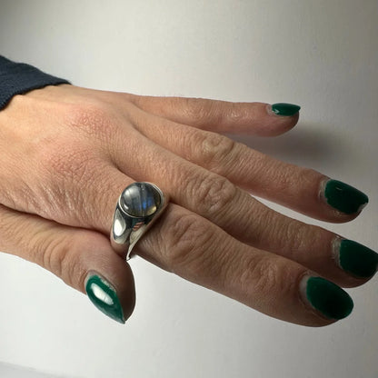 Sleek sterling silver labradorite ring with iridescent blue oval stone