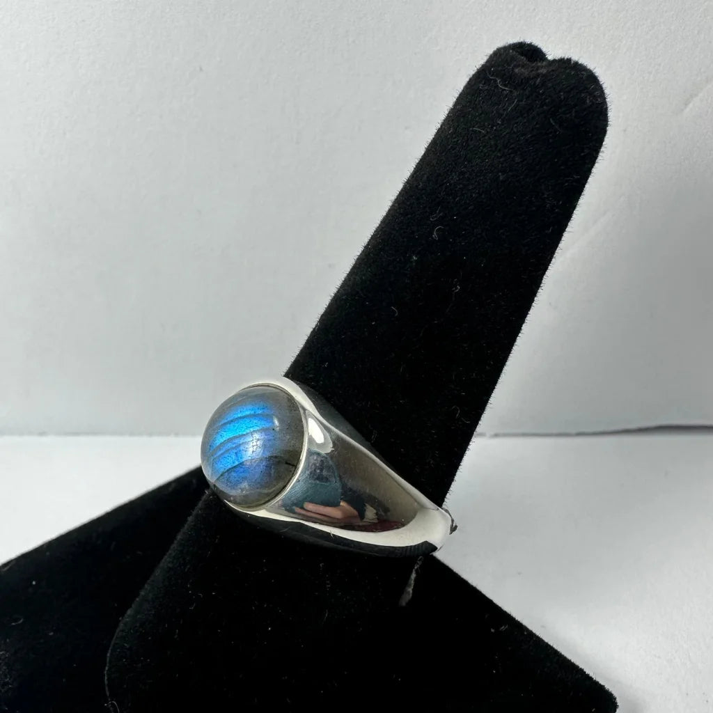 Sleek sterling silver labradorite ring with iridescent blue oval stone