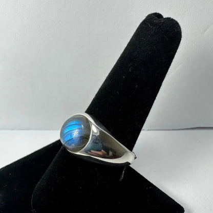 Sleek sterling silver labradorite ring with iridescent blue oval stone
