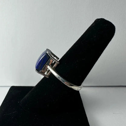 Sleek silver lapis lazuli ring with oval deep blue stone