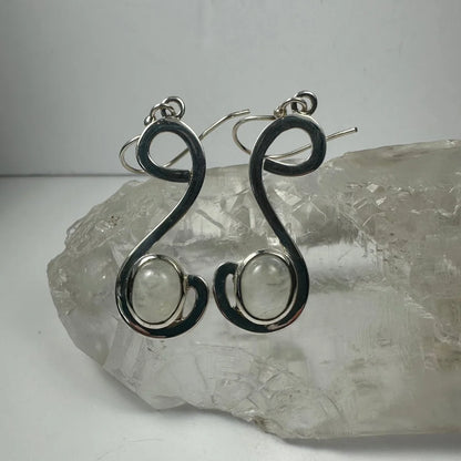 Handcrafted silver moonstone earrings with swirling wire design