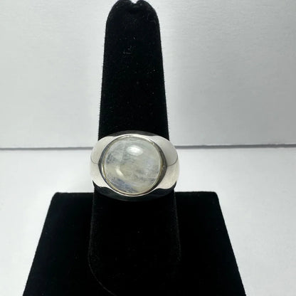 Sleek sterling silver moonstone ring with iridescent oval glow