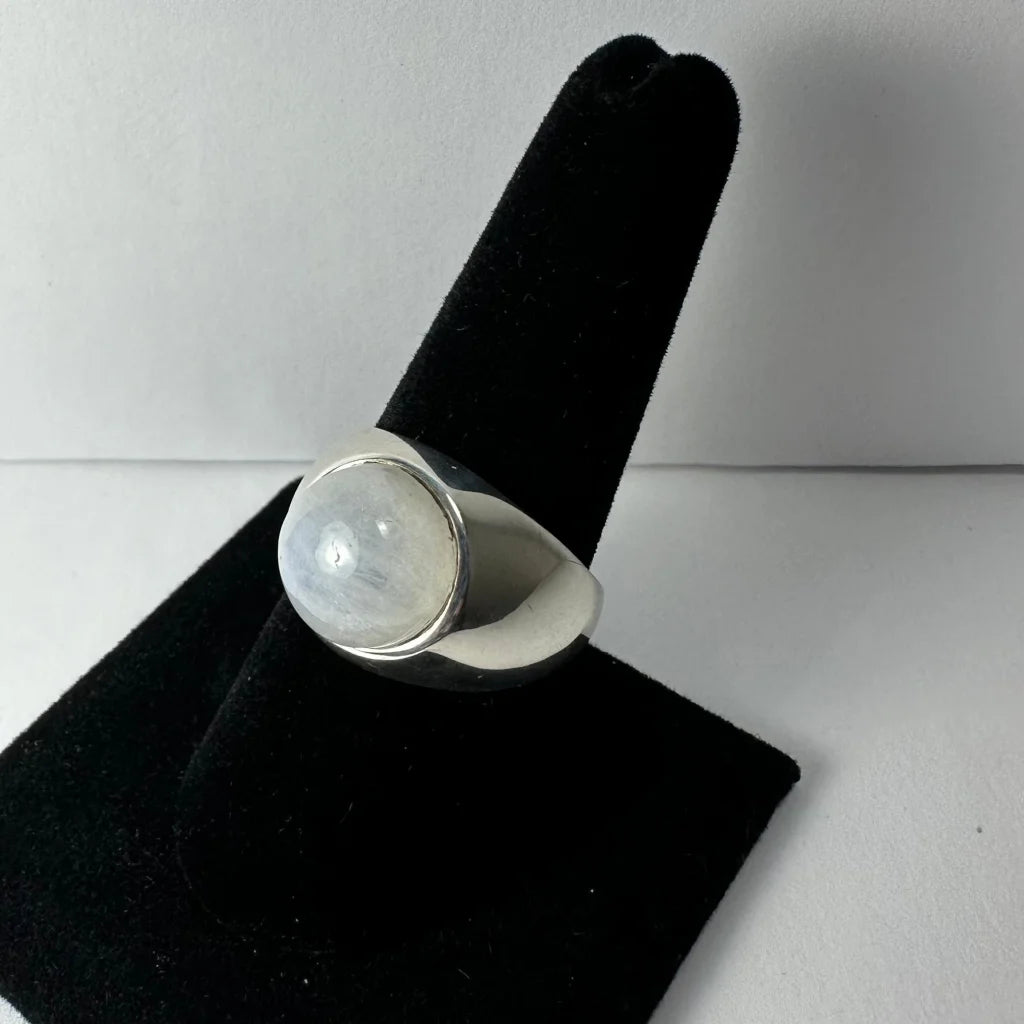 Sleek sterling silver moonstone ring with iridescent oval glow