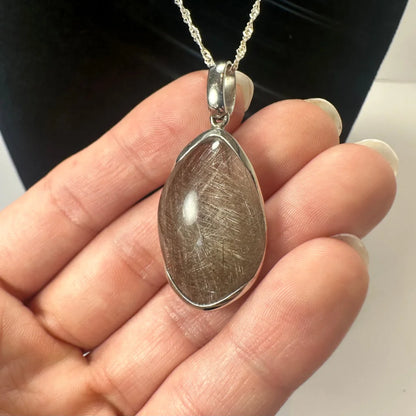 Stunning sterling silver rutilated quartz teardrop pendant with brownish crystal
