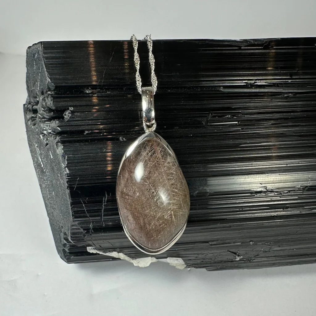 Stunning sterling silver rutilated quartz teardrop pendant with golden inclusions
