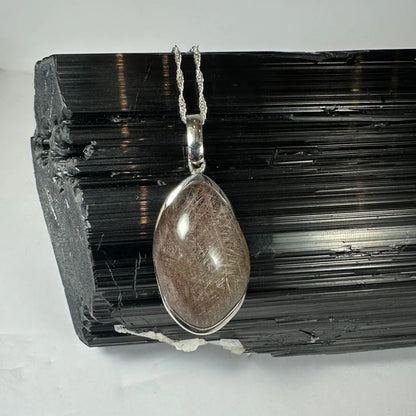 Stunning sterling silver rutilated quartz teardrop pendant with golden inclusions