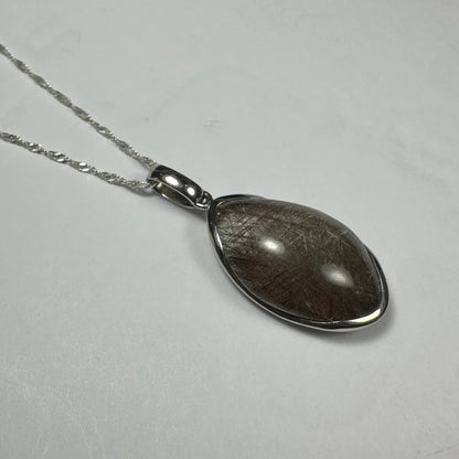 Stunning sterling silver rutilated quartz teardrop pendant with golden inclusions