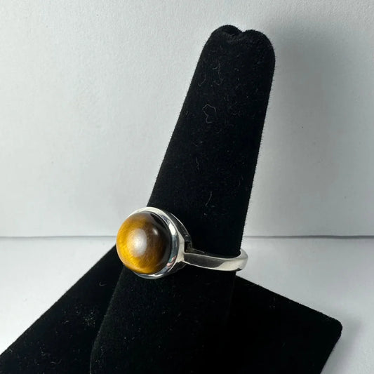Sleek sterling silver tiger eye ring with golden bezel stone