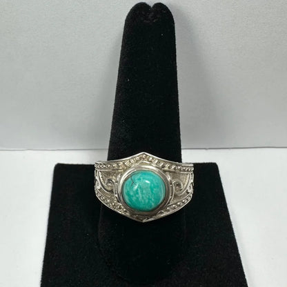 Stunning silver turquoise ring with ornate beaded band and round stone