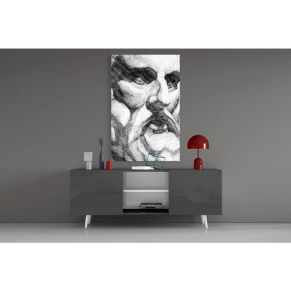 Black-and-white stippled face wall art canvas above gray console