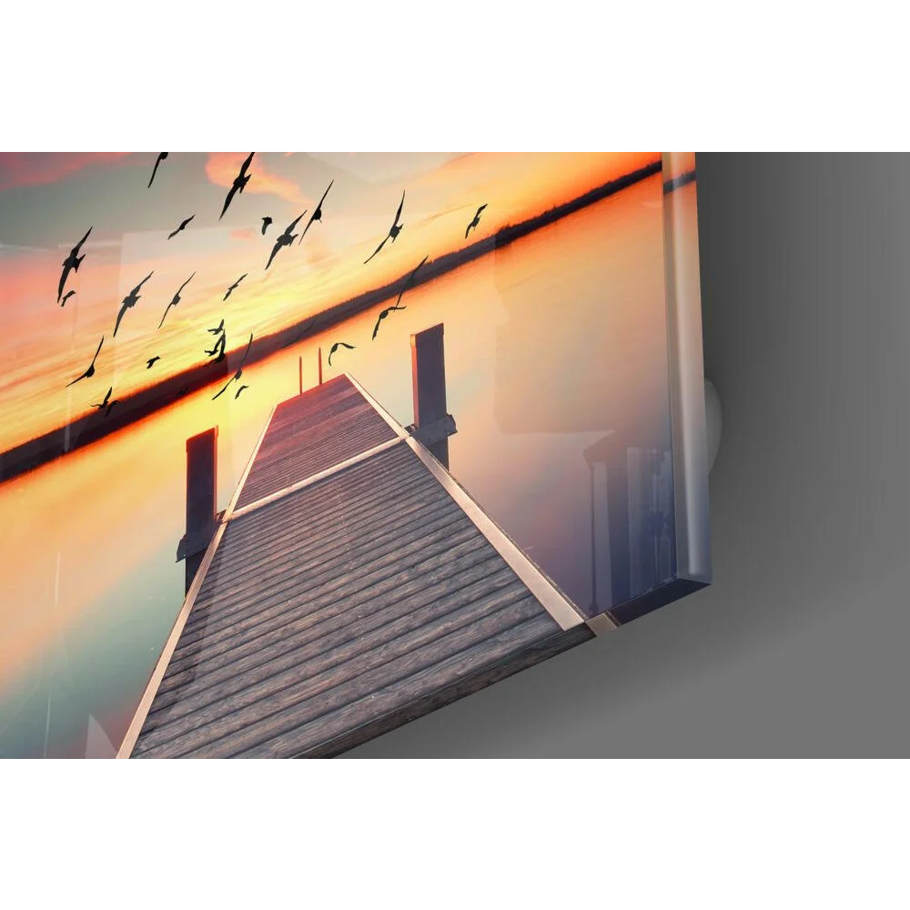 Stunning sunset dock glass wall art with wooden shingled roof, chimneys, and flying birds