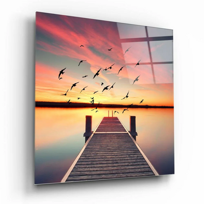 Stunning sunset dock glass wall art with birds flying over wooden dock