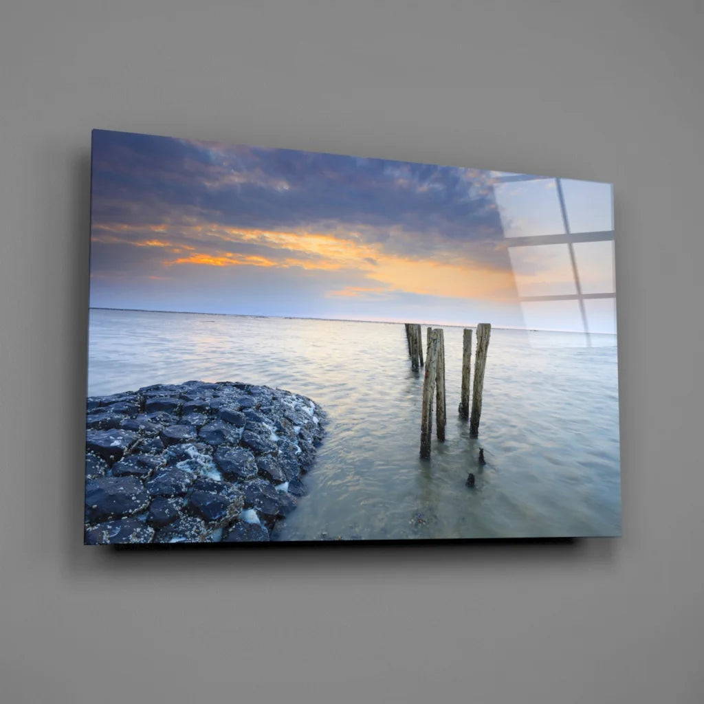 Stunning blue orange sunset glass wall art with ocean pier posts