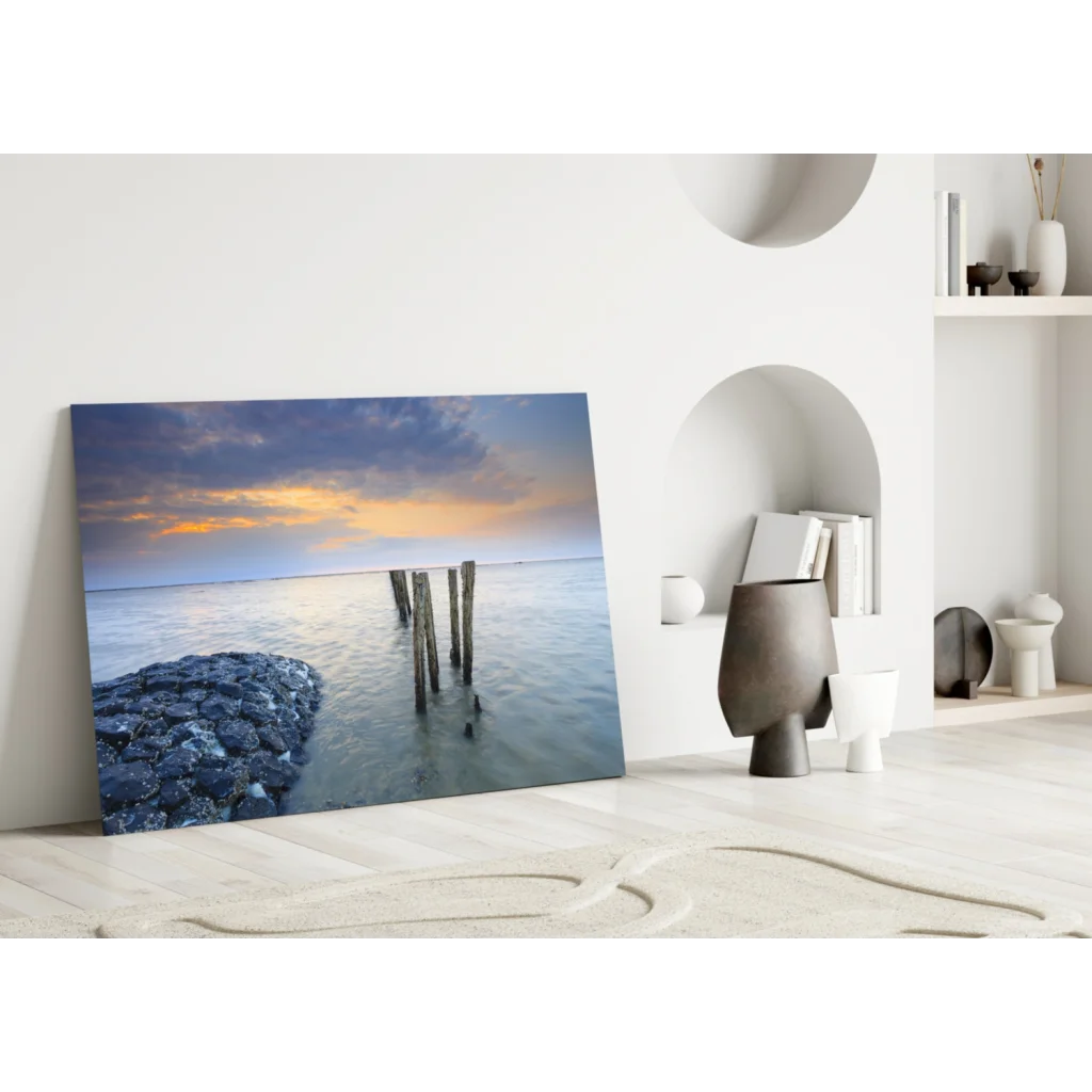 Stunning sunset glass wall art with ocean pier posts in blues and oranges