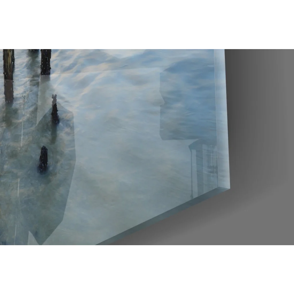 Stunning sunset glass wall art with reflective silver mirror and ocean pier