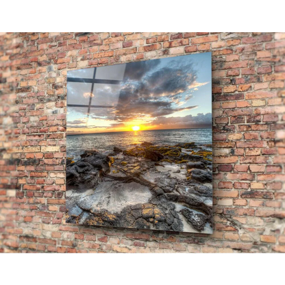 Stunning sunset glass wall art over rocky shoreline