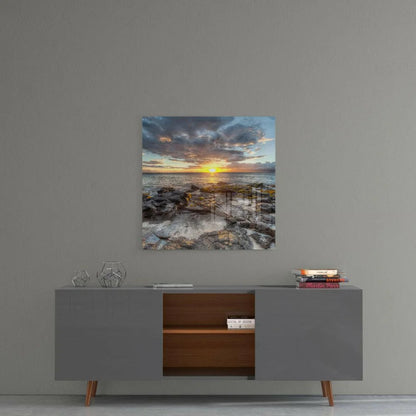 Modern gray sideboard with copper legs and open shelves under Stunning Sunset glass wall art