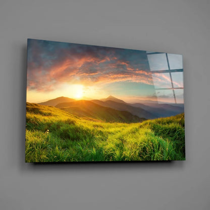 Vibrant sunset glass wall art over rolling green hills
