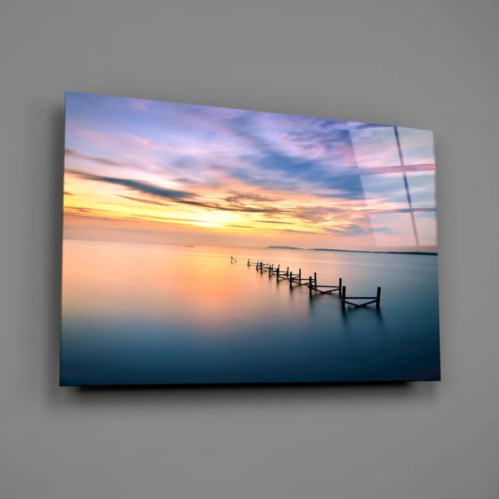 Serene sunset over water with pier, vibrant orange purple wall art canvas