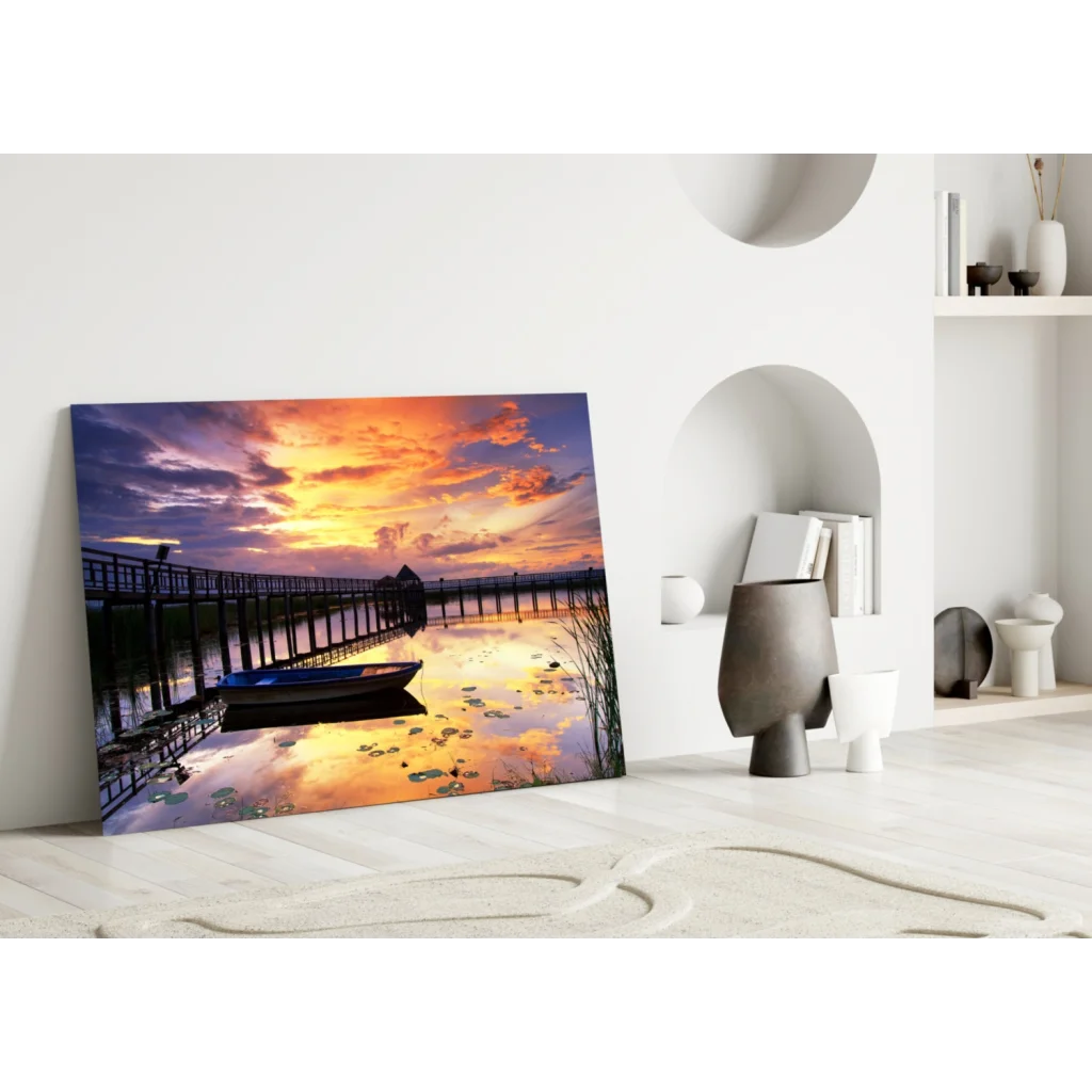 Vibrant sunset pier glass wall art with boat and water lilies