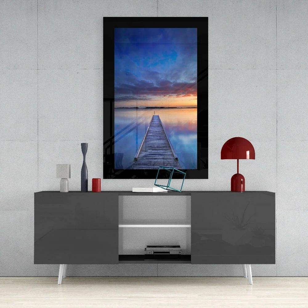 Modern gray TV stand with white legs and open storage for glass wall art