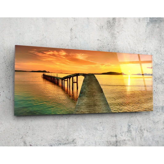 Vibrant sunset pier on tempered glass art, warm hues over water