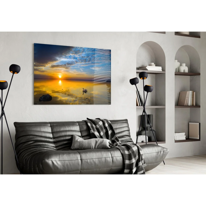 Leather sofa with plaid throw under Stunning Sunset Swan wall art