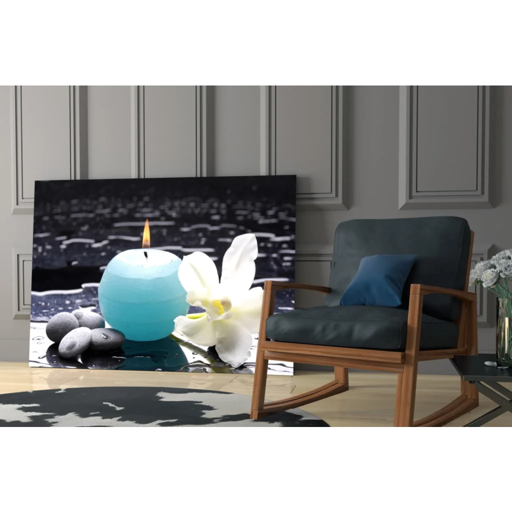 Stunning teal blue sphere candle with white orchid on black glass wall art