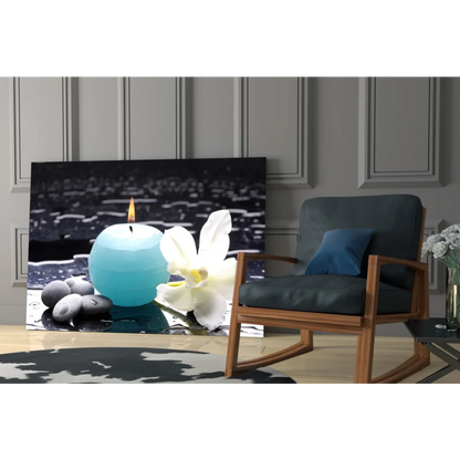 Stunning teal blue sphere candle with white orchid on black glass wall art