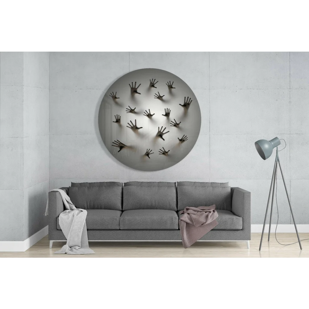 Stunning tempered glass art with silver circular design and bold black handprints