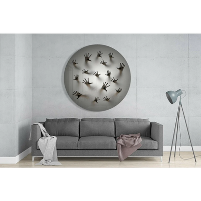 Stunning tempered glass art with silver circular design and bold black handprints