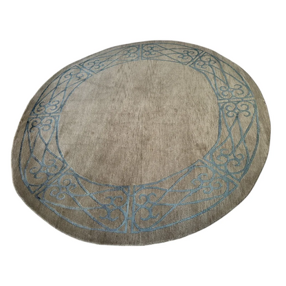 Stunning Tibetan rug with circular beige design and blue border