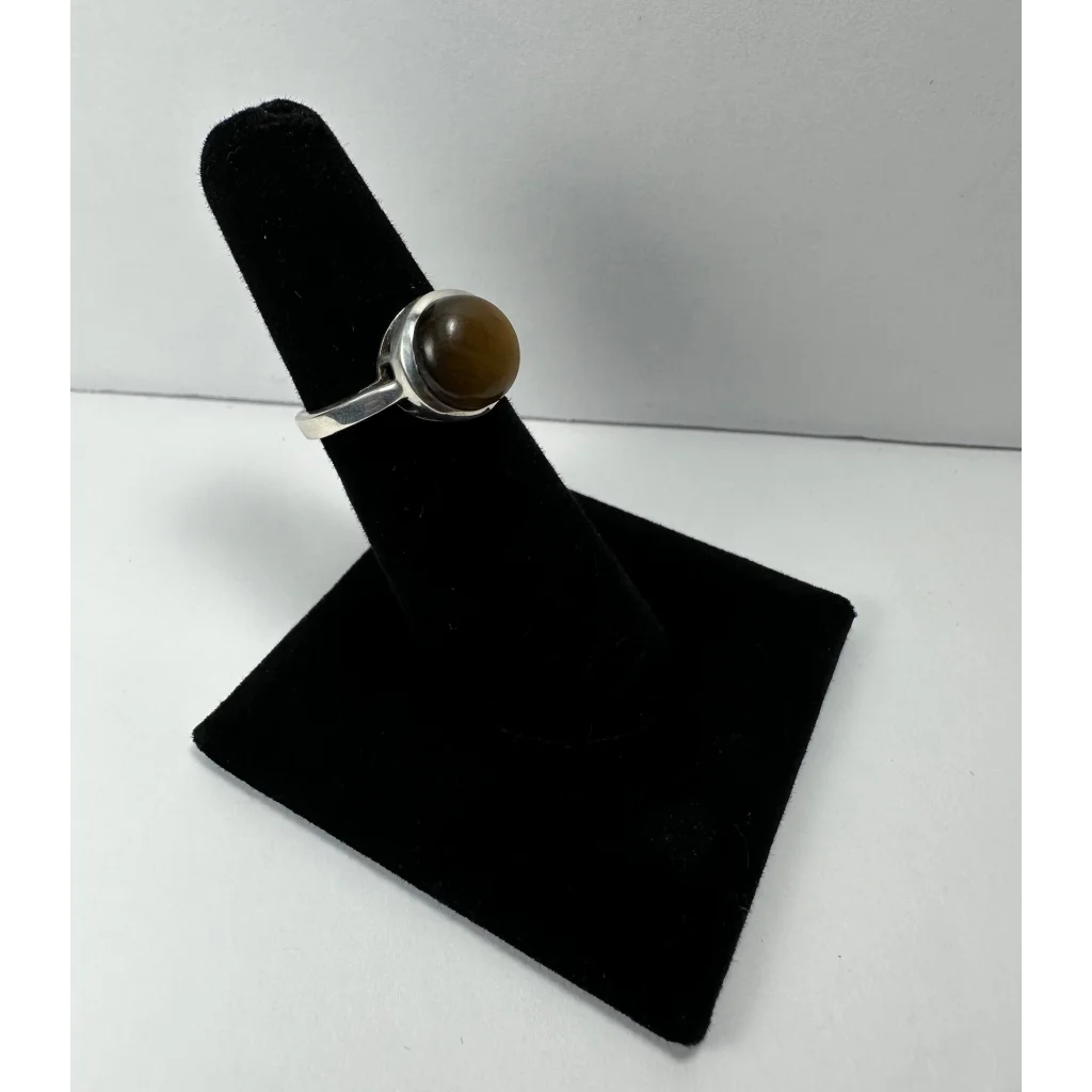 Stunning tiger eye ring in sterling silver with smooth amber stone