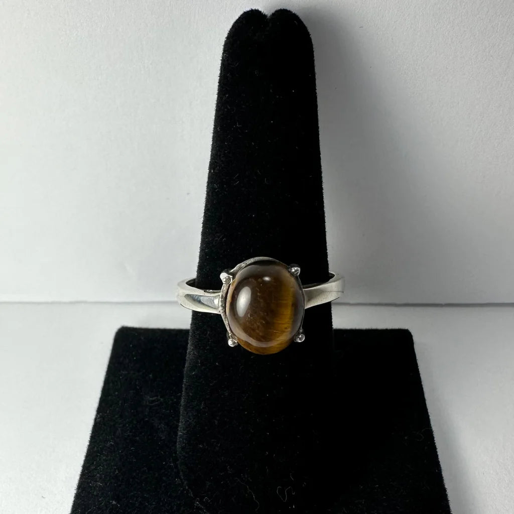 Stunning silver tiger eye ring with oval prong-set stone