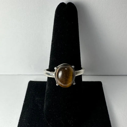Stunning silver tiger eye ring with oval prong-set stone