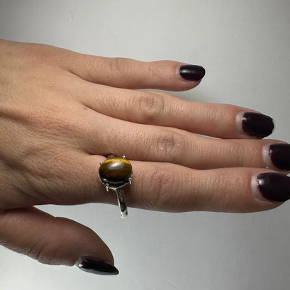 Stunning silver tiger eye ring with oval prong-set stone