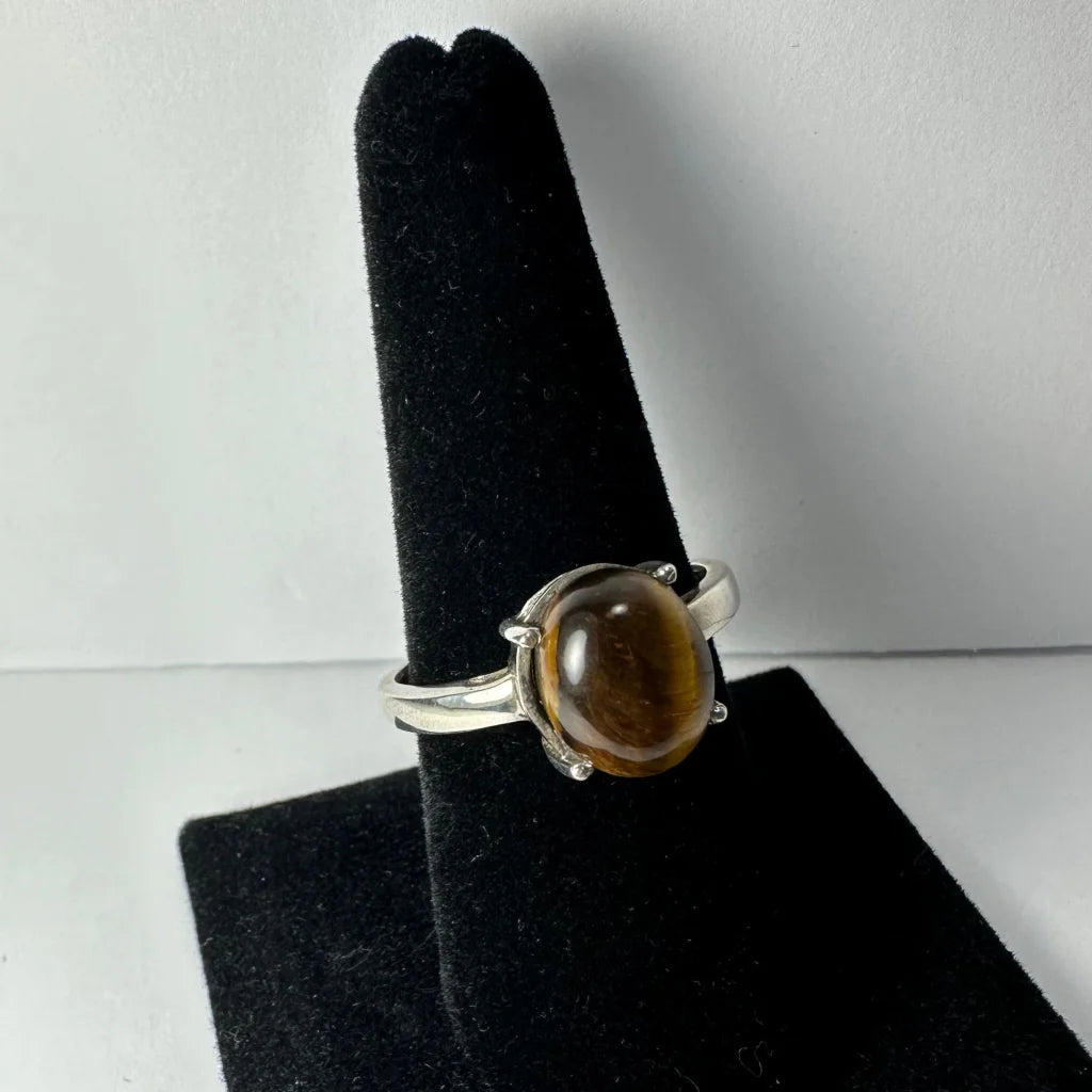 Stunning silver tiger eye ring with oval prong-set stone