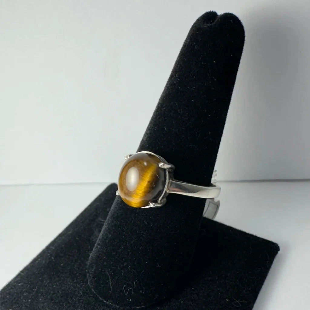 Stunning silver tiger eye ring with oval stone in four-prong setting