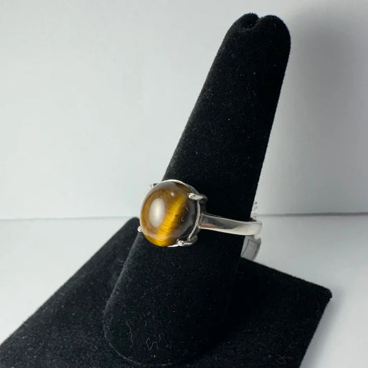 Stunning silver tiger eye ring with oval stone in four-prong setting